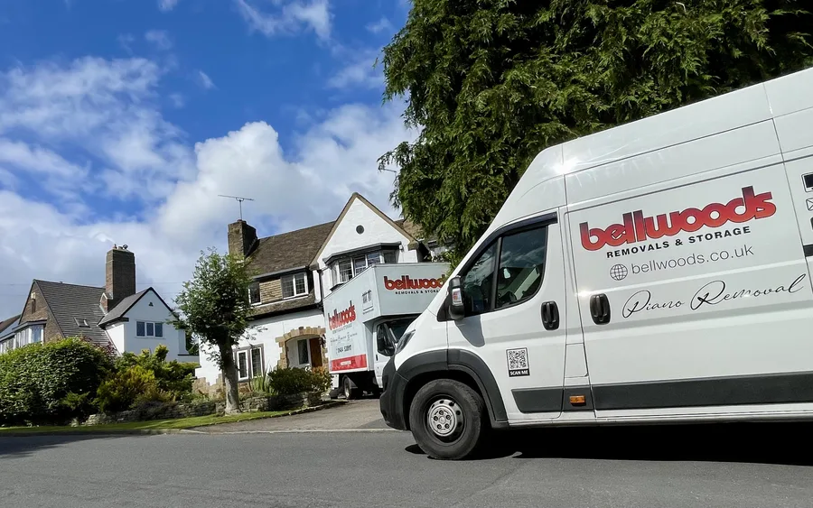 Bellwoods Removals piano removal van and lorry parked outside a house on a residential street