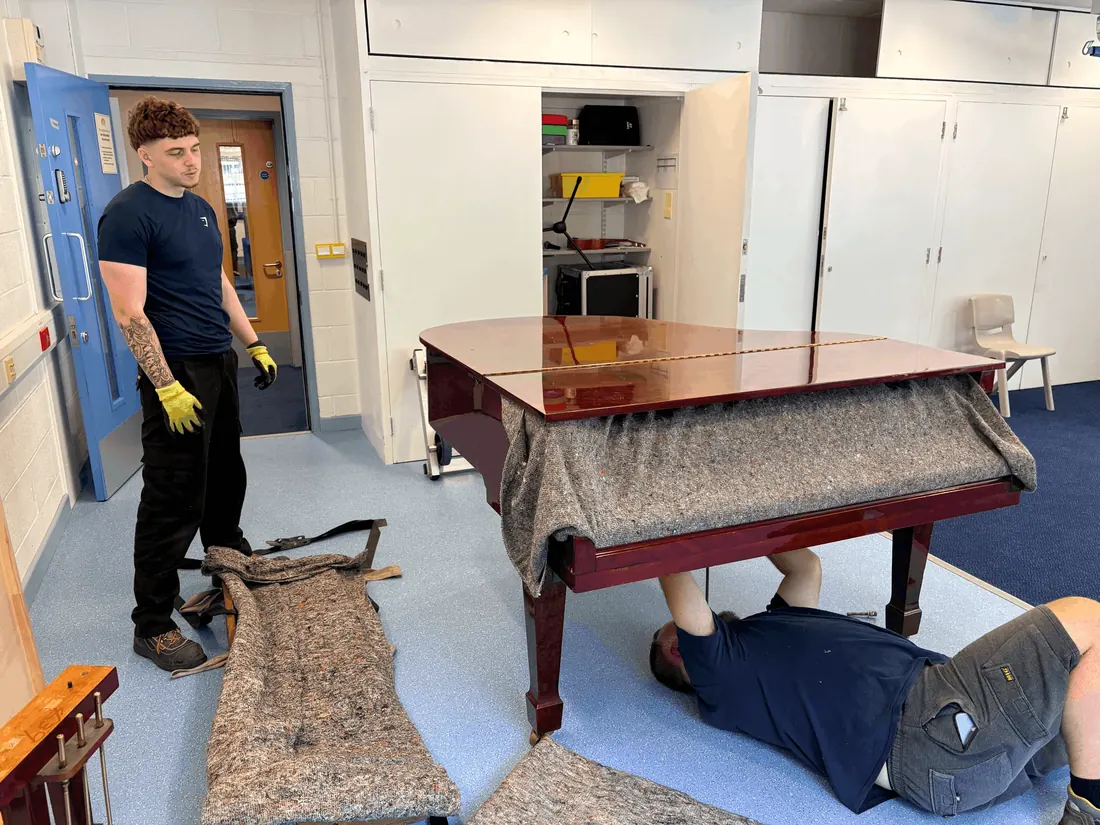 Grand piano partly dismantled ready for a specialist long-distance move